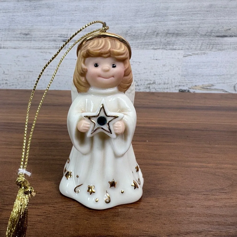 Lenox May birthstone Porcelain Angel Ornament features a hand-painted gold halo